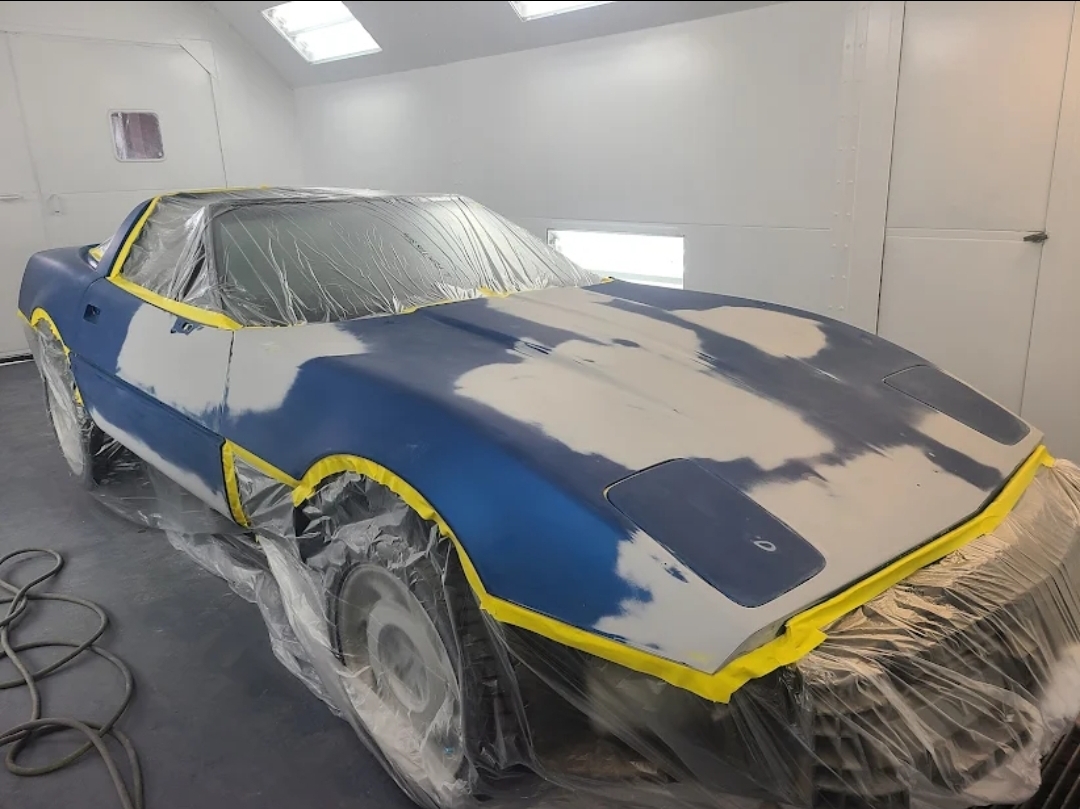 Corvette inside the professional paint booth