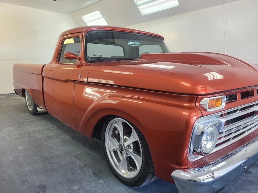 Orange Ford truck after paint job