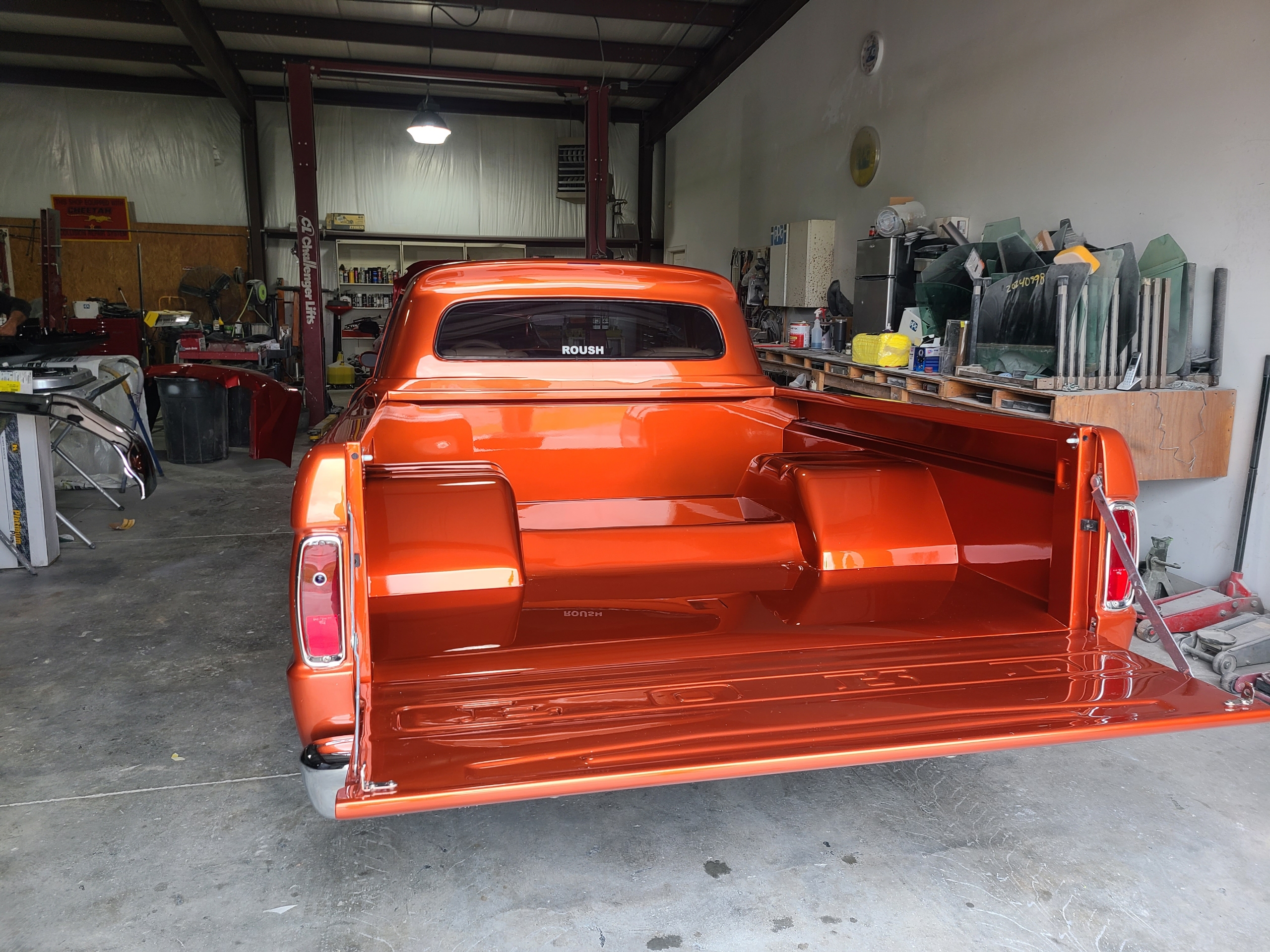 Custom orange truck with a deep glossy finish