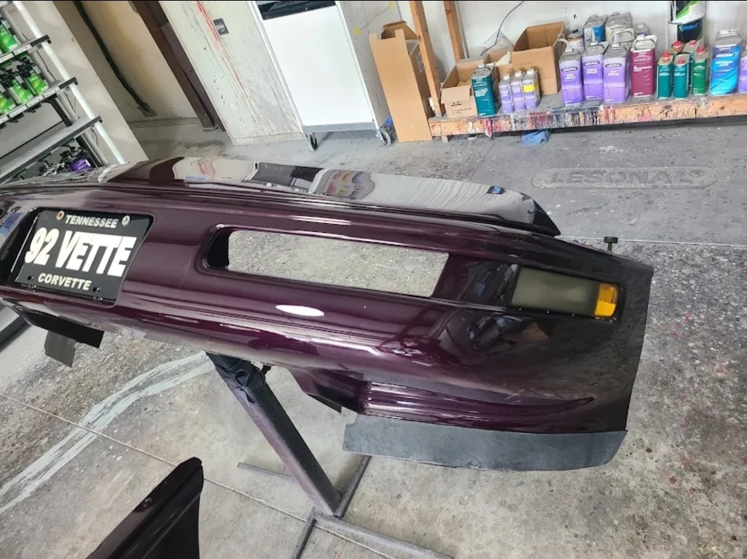 Rear view of a deep purple Corvette