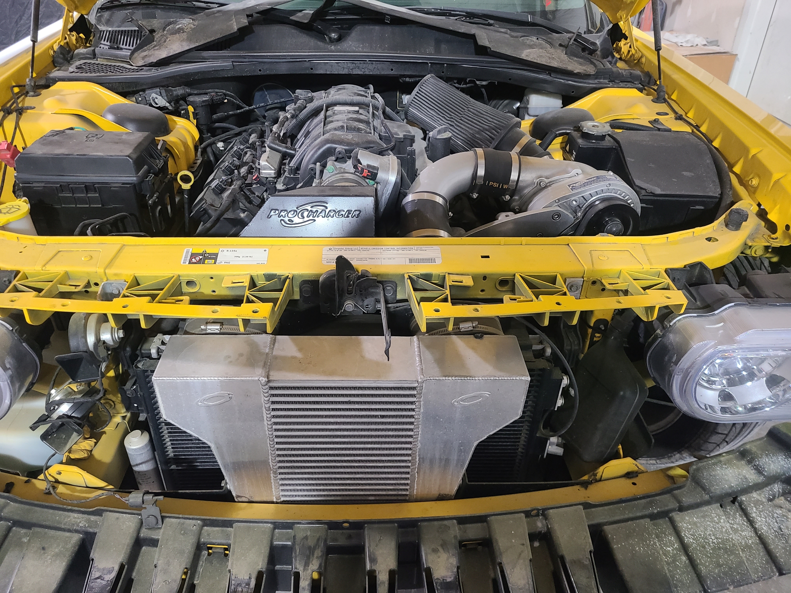 Yellow Camaro ProCharger supercharger installation